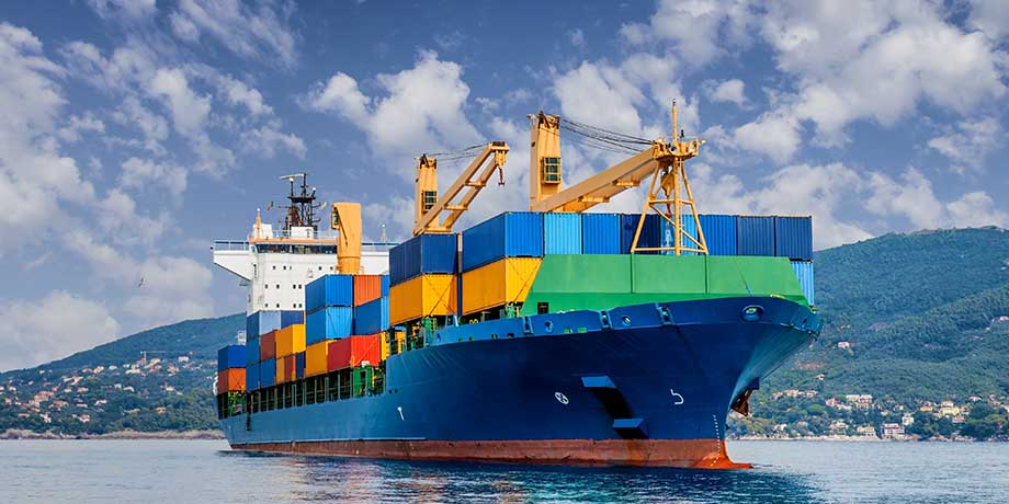 Cargo ship ferrying containers powered by green fuel