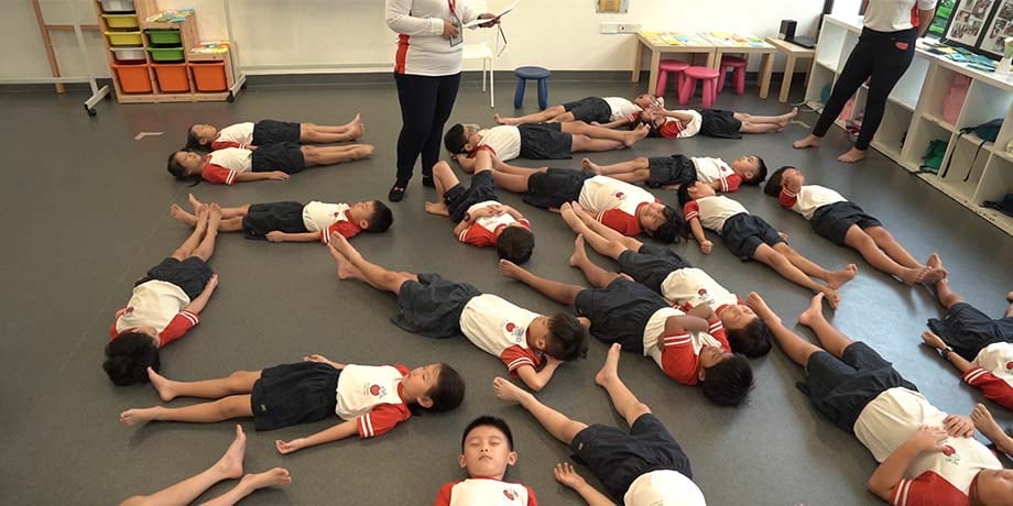 Students take part in a mindful breathing exercise