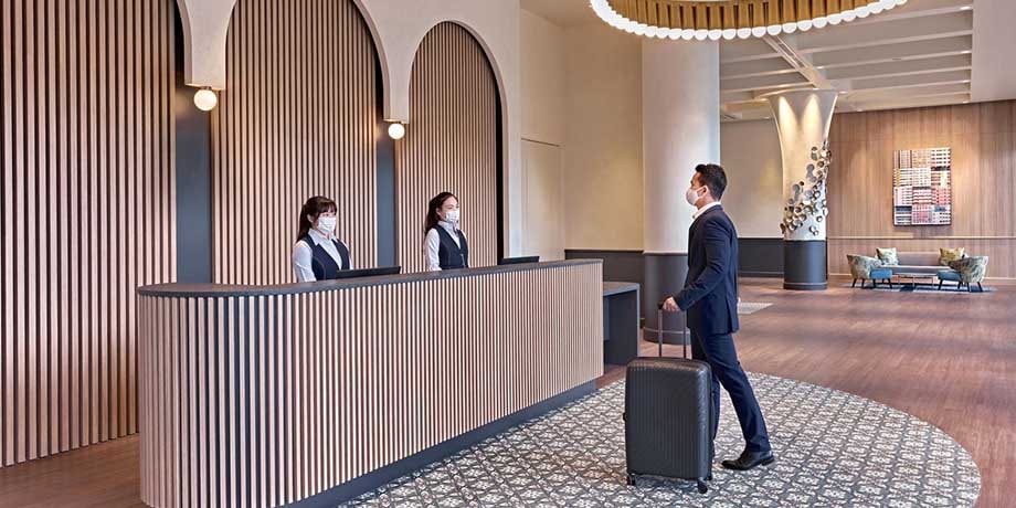 Reception desk and concierge greeting guest at Connect@Changi