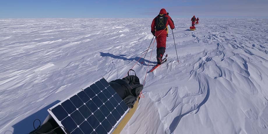 Swan and Barney towing sledges with solar panels