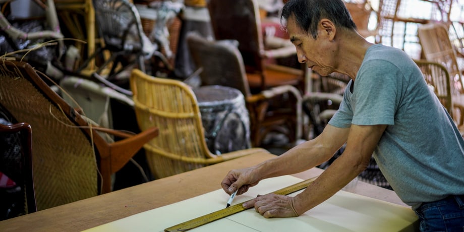 Rattan shopowner at work in Singapore