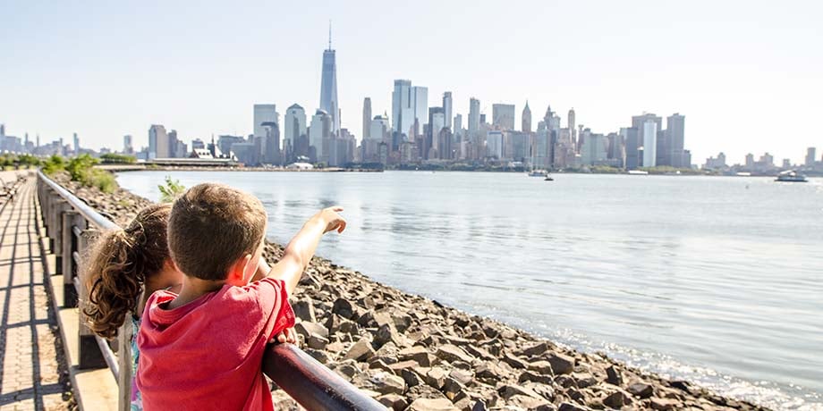 Kids pointing at skyline