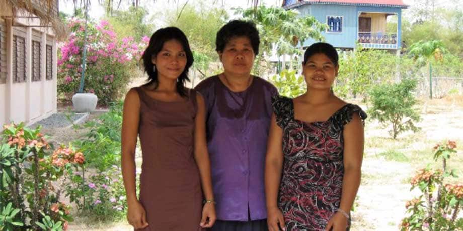 Woman with villagers in rural Cambodia